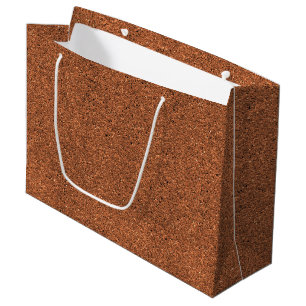 A brown paper bag with a white handle