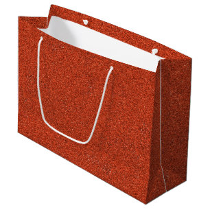 A brown paper shopping bag with white handles