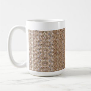 A brown rug displaying a symmetrical design featur coffee mug