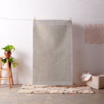A brown rug with an intricate motif lies on the fl fabric