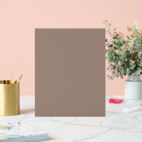 a brown wall with a clock on it