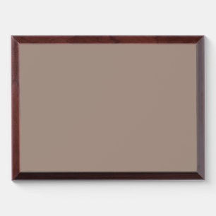 a brown wall with a clock on it award plaque