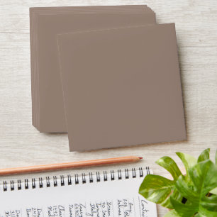 a brown wall with a clock on it envelope