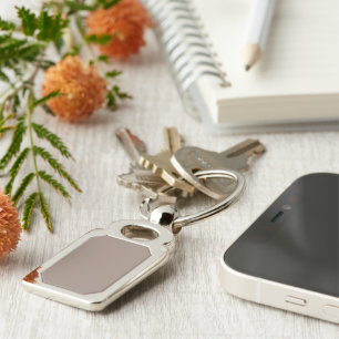 a brown wall with a clock on it keychain