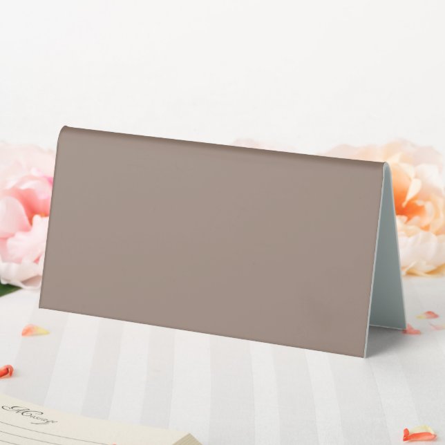 a brown wall with a clock on it table tent (In SItu (Wedding))