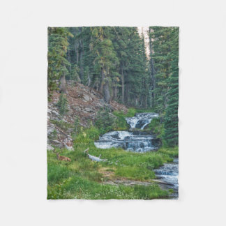 A Buck Rests at a Cascading River Fleece Blanket