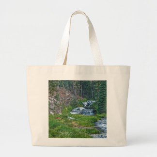 A Buck Rests at a Cascading River Large Tote Bag