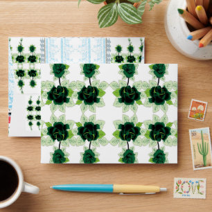 a bunch of green flowers on a white background envelope
