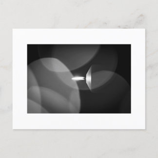 A burning candle postcard