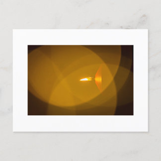 A burning candle postcard