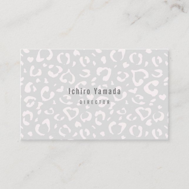 a business card with a white leopard pattern (Front)