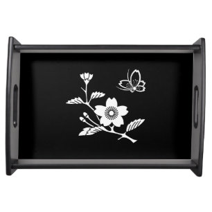 A butterfly in the middle of a cherry tree serving tray