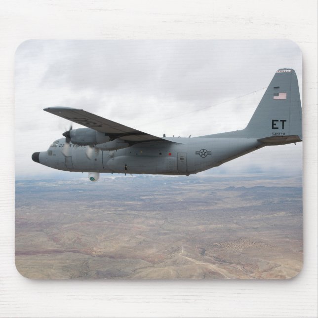 A C-130 Hercules soars through the sky Mouse Pad (Front)