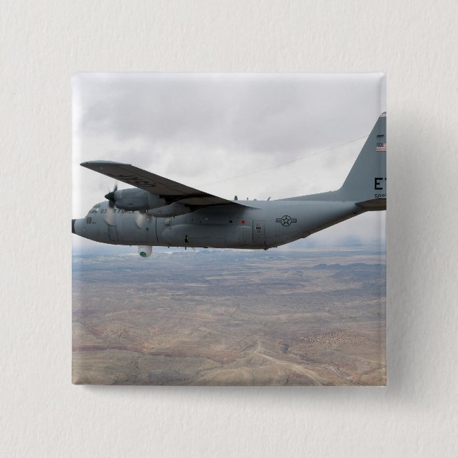 A C-130 Hercules soars through the sky Pinback Button (Front)