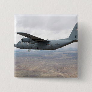 A C-130 Hercules soars through the sky Pinback Button