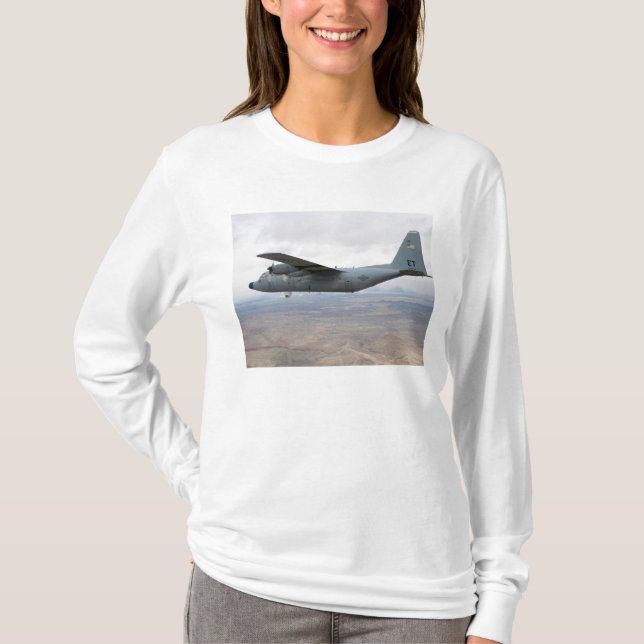 A C-130 Hercules soars through the sky T-Shirt (Front)