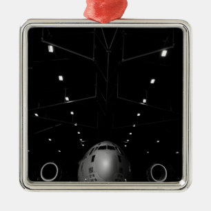 A C-17 Globemaster III sits in a hangar Metal Ornament