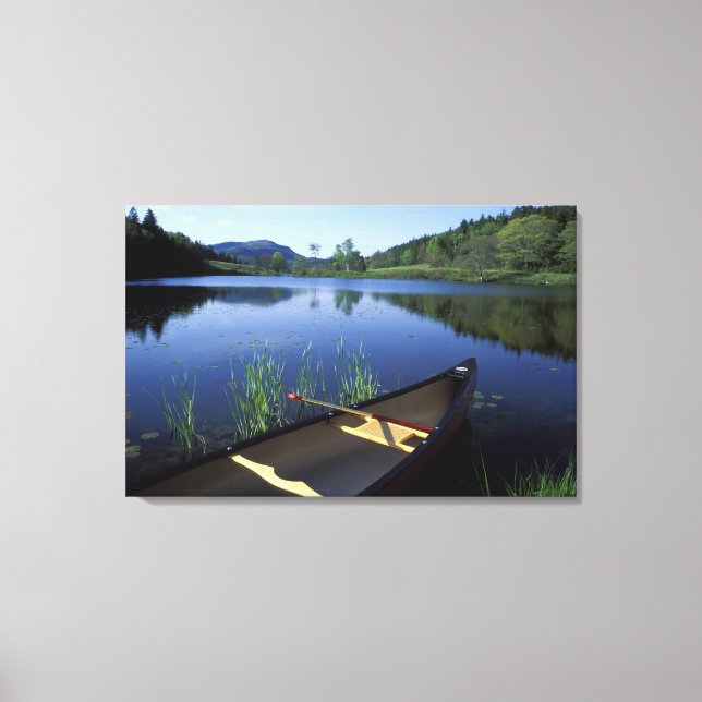 A canoe rests on the shore of Little Long Pond Canvas Print (Front)