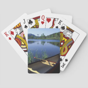A canoe rests on the shore of Little Long Pond Poker Cards