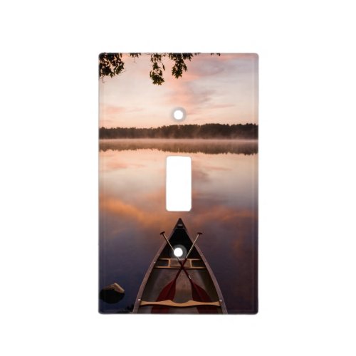 A canoe rests on the shore of Pawtuckaway Lake Light Switch Cover