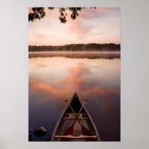 A canoe rests on the shore of Pawtuckaway Lake Poster