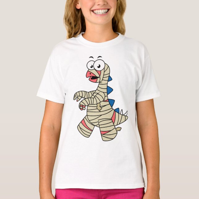 A Cartoon Stegosaurus Dressed Up As A Mummy. T-Shirt (Front)