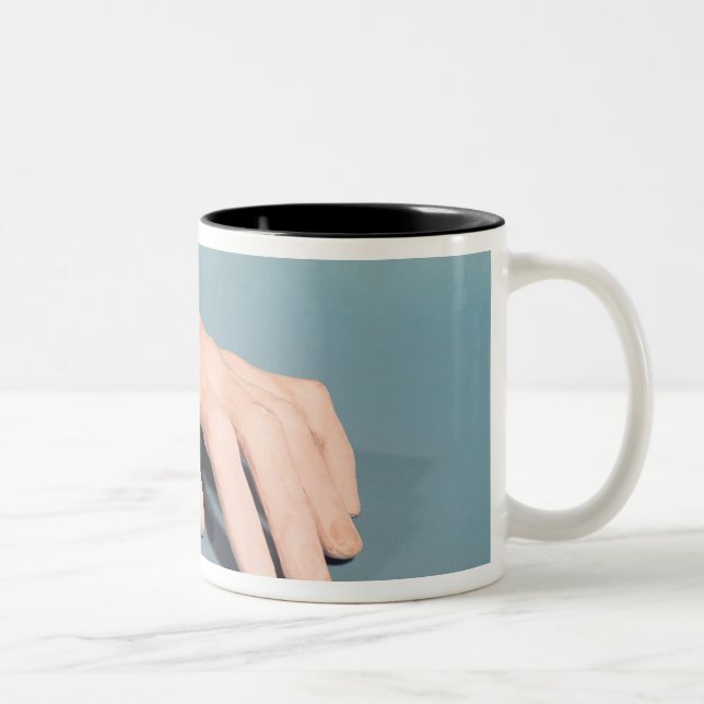 A cast of the hand of Frederic Chopin Two-Tone Coffee Mug (Right)