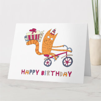 A cat on a bicycle carries birthday gifts. card