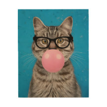 A cat wearing glasses and blowing a pink bubble
