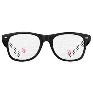 A circular logo featuring a heart symbol, embodyin retro sunglasses