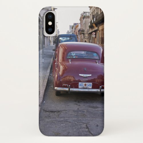 A classic old red Peugeot car parked on a street iPhone X Case