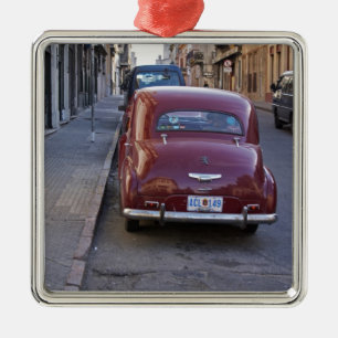 A classic old red Peugeot car parked on a street Metal Ornament