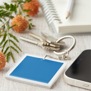A clear blue sky with no clouds fills the entire f keychain