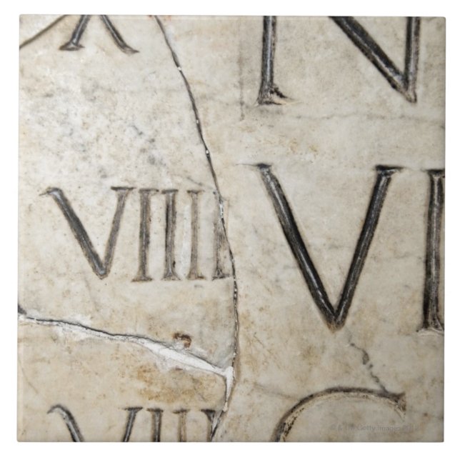 A close-up of ancient Roman letters on marble. Tile (Front)