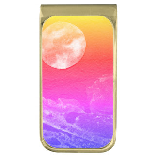 A close up view of fantasy worlds and their moons gold finish money clip