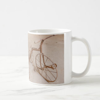 a coffee mug with a photo of an old tricycle