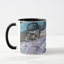 A coffee mug with purple and blue artwork