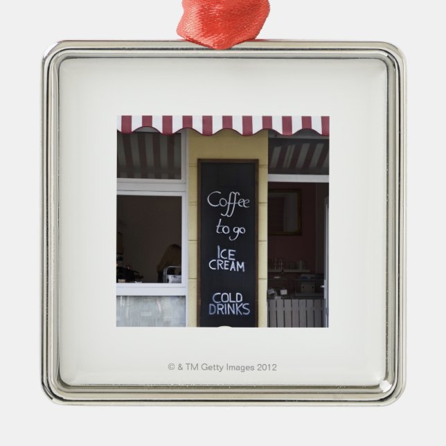 a coffee shop with a coffee to go sign metal ornament (Front)