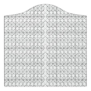 A colorful rug with an intricate geometric pattern door sign