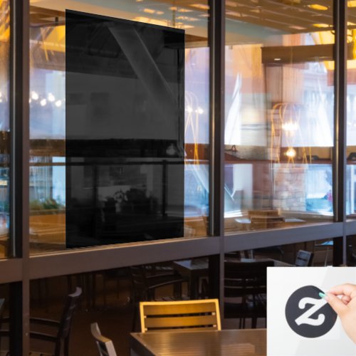 A completely black image with a subtle textured window cling