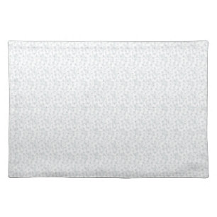 A completely white, featureless surface fills the  cloth placemat