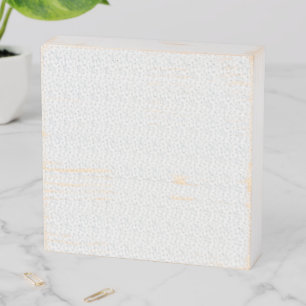 A completely white, featureless surface fills the  wooden box sign