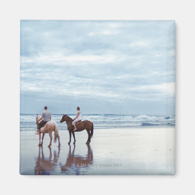 A couple riding horses on Parkiri beach in New Magnet (Front)