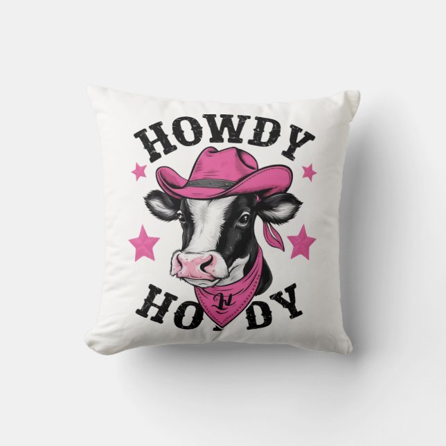 A cow wearing a vibrant pink cowboy throw pillow (Front)