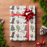 A Cowboy Merry Christmas Wrapping Paper<br><div class="desc">This holiday season put a smile on someone's face with this cowboy themed gift wrapping paper. This playful and unique design includes a full Western theme with colorful illustrations to include cowboy boots,  cactus,  horseshoes,  Christmas trees and candy canes.</div>