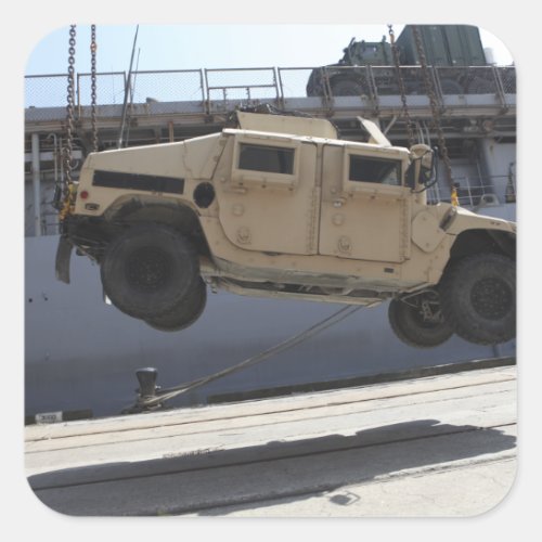 A crane lifts an M998 Humvee Square Sticker