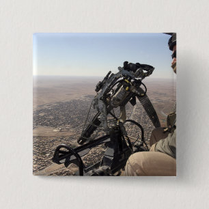 A crew chief looks for suspicious activity pinback button