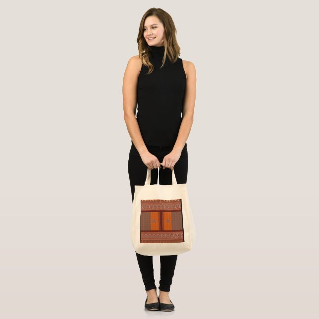 a cross stitch pattern in orange and brown tote bag (Front (Model))