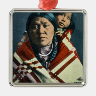 A Crow Indian Madonna and Child Metal Ornament