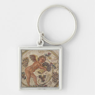 A cupid picking grapes, fragment of pavement keychain